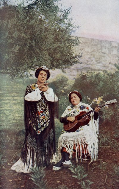 While her companion plays the guitar, the young girl lightly claps her hands. Most Spanish dancers favor this form of accompaniment by Unknown